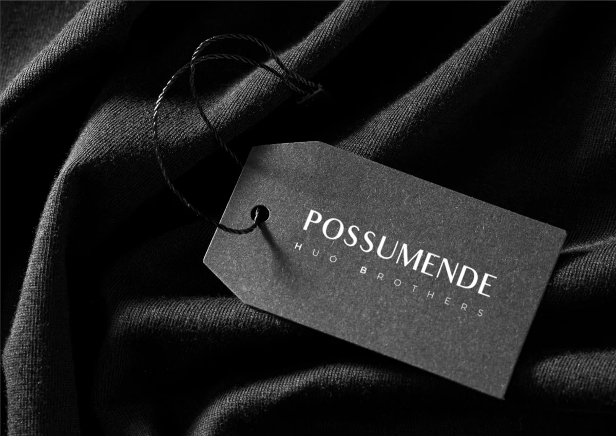 Possumende swing tag on black fabric